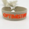 Beiges Armband von Moselzeug mit Schriftzug Optimistin