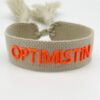 Beiges Armband von Moselzeug mit Schriftzug Optimistin